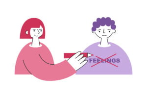 a sad person with the word 'feelings' written on his chest. a woman with a mean expression is crossing out the word 'feelings' with a pencil